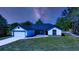 Beautiful home exterior with a manicured lawn, accent stones, and modern design at 19 Juniper Pass, Ocala, FL 34480
