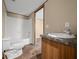 Bathroom features a shower-tub combo and single sink vanity at 221 Se 167Th Ct, Silver Springs, FL 34488