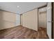 Open bedroom with wood floors and neutral wall colors at 221 Se 167Th Ct, Silver Springs, FL 34488