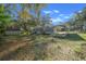 Charming home with a covered carport on a grassy lot with mature trees at 221 Se 167Th Ct, Silver Springs, FL 34488