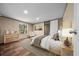 Bedroom features wood floors, a plush bed and natural light at 221 Se 167Th Ct, Silver Springs, FL 34488