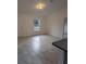 Bright living room featuring tile floors and ample natural light, creating a welcoming space at 261 Locust Pass Loop, Ocala, FL 34472