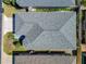 A top down aerial shot of the roof of a house with manicured bushes and grass surrounding it at 3312 Sw 38Th Pl, Ocala, FL 34474