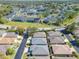An aerial view of a quiet neighborhood showcases the real estate and its surrounding community at 3312 Sw 38Th Pl, Ocala, FL 34474