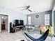 This bedroom has tile floors, ceiling fan, and a sliding glass door to the outside at 3312 Sw 38Th Pl, Ocala, FL 34474