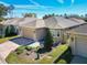 Aerial view of a one story home showcasing the manicured lawn and the neutral toned exterior paint at 3312 Sw 38Th Pl, Ocala, FL 34474