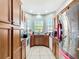 An open kitchen design with wood cabinets, stainless steel appliances, and tile flooring at 3312 Sw 38Th Pl, Ocala, FL 34474