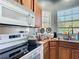 A well organized kitchen with stainless steel appliances, wood cabinets and wood countertops at 3312 Sw 38Th Pl, Ocala, FL 34474