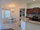 Bright kitchen with granite countertops, stainless steel appliances, and a cozy eat-in area at 3819 Se 99Th St, Belleview, FL 34420