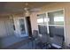 Covered outdoor patio with ceiling fans and comfortable seating, perfect for relaxing at 3819 Se 99Th St, Belleview, FL 34420