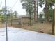 Side view of an animal pen with an open roof, set on a large lot with a concrete base at 4184 Ne 138Th Pl, Anthony, FL 32617