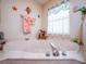 Inviting soaking tub features accents such as starfish and ocean themed towels and decor at 4941 Nw 32 Street, Ocala, FL 34482