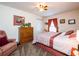 Comfortable bedroom featuring a ceiling fan, carpeted floor, and neutral wall color at 4941 Nw 32 Street, Ocala, FL 34482