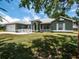 Charming single-story home with well-manicured lawn and inviting front porch at 4941 Nw 32 Street, Ocala, FL 34482