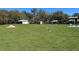 Expansive backyard featuring outbuildings and ample green space at 5124 Cr 634S, Bushnell, FL 33513