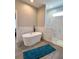 Bright bathroom featuring a modern soaking tub and a walk-in shower with white marble tiles at 5124 Cr 634S, Bushnell, FL 33513