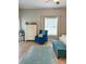 Cozy bedroom with natural light, a comfortable chair, and neutral walls at 5124 Cr 634S, Bushnell, FL 33513