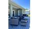 Spacious covered patio featuring comfortable seating for entertaining and relaxing at 5124 Cr 634S, Bushnell, FL 33513