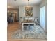Open-concept dining area with a light fixture and seamless transition to the kitchen at 5124 Cr 634S, Bushnell, FL 33513