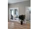 Stylish entryway with a view into a bright living area with French doors and light, wood-look floors at 5124 Cr 634S, Bushnell, FL 33513