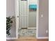 Hallway with a closet, neutral paint color, and wood-look flooring at 5124 Cr 634S, Bushnell, FL 33513