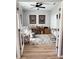 Home office featuring two desks, a ceiling fan, and plenty of natural light at 5124 Cr 634S, Bushnell, FL 33513