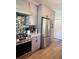 Modern kitchen features stainless steel appliances, gray cabinets, and a decorative backsplash at 5124 Cr 634S, Bushnell, FL 33513