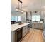 Bright, open kitchen with a large island, stainless steel appliances, and ample cabinet space at 5124 Cr 634S, Bushnell, FL 33513