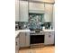 Modern kitchen features stainless steel appliances, quartz countertops, and colorful backsplash at 5124 Cr 634S, Bushnell, FL 33513