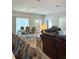 Spacious living room featuring modern decor, wood-look floors, and a dining area at 5124 Cr 634S, Bushnell, FL 33513