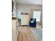 Bright living room showcases tasteful decor, a cozy blue armchair, and sleek vinyl floors, perfect for relaxing at 5124 Cr 634S, Bushnell, FL 33513