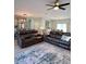 Spacious living room with plush leather seating and an open floor plan, great for entertaining at 5124 Cr 634S, Bushnell, FL 33513