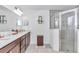 Bathroom with a double sink vanity and glass shower at 5620 Sw 172Nd Loop, Ocala, FL 34473