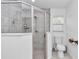 Bathroom glass enclosed shower featuring tiled walls and a handheld shower head at 5620 Sw 172Nd Loop, Ocala, FL 34473