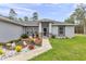 Charming home exterior with a well-manicured lawn, rock landscaping and a welcoming front entrance at 5620 Sw 172Nd Loop, Ocala, FL 34473