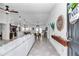 Bright, open-concept living space with a view of the dining and kitchen areas, featuring a modern design at 5620 Sw 172Nd Loop, Ocala, FL 34473
