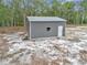 Aerial view of an outbuilding or shed on the property, providing extra storage space at 5620 Sw 172Nd Loop, Ocala, FL 34473