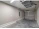 Empty, clean garage featuring a door and concrete floor at 59 Fisher Ct, Ocklawaha, FL 32179
