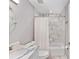 Bright bathroom showcasing a white vanity, a toilet, and shower with marble style tile at 8330 Se 161St St, Summerfield, FL 34491