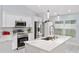 Beautiful kitchen featuring stainless steel appliances, stone countertops, and lots of storage space at 8330 Se 161St St, Summerfield, FL 34491