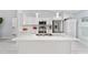 Modern kitchen with marble countertops, stainless steel appliances, and white cabinetry at 8330 Se 161St St, Summerfield, FL 34491