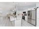 Spacious open kitchen with marble countertops, stainless steel appliances and direct access to the living room at 8330 Se 161St St, Summerfield, FL 34491