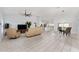 Open living area featuring neutral decor, tile flooring, and seamless access to the kitchen and dining area at 8330 Se 161St St, Summerfield, FL 34491