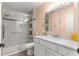 Updated bathroom featuring a glass-enclosed shower and modern vanity with ample counter space at 8710 Sw 91St Pl # E, Ocala, FL 34481