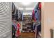 Spacious walk-in closet with shoe rack and ample shelving for organized storage at 8710 Sw 91St Pl # E, Ocala, FL 34481