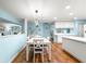 Bright dining area features an open-concept design that flows into the kitchen at 8710 Sw 91St Pl # E, Ocala, FL 34481