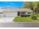 Charming single-story home with a well-manicured front yard and inviting entrance at 8710 Sw 91St Pl # E, Ocala, FL 34481