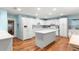 Spacious kitchen featuring white cabinetry, stainless steel appliances, and a center island at 8710 Sw 91St Pl # E, Ocala, FL 34481