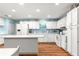 Well-equipped kitchen with stainless steel appliances, a center island, and ample counter space at 8710 Sw 91St Pl # E, Ocala, FL 34481