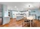 Bright kitchen featuring white cabinetry, a center island, and modern appliances at 8710 Sw 91St Pl # E, Ocala, FL 34481